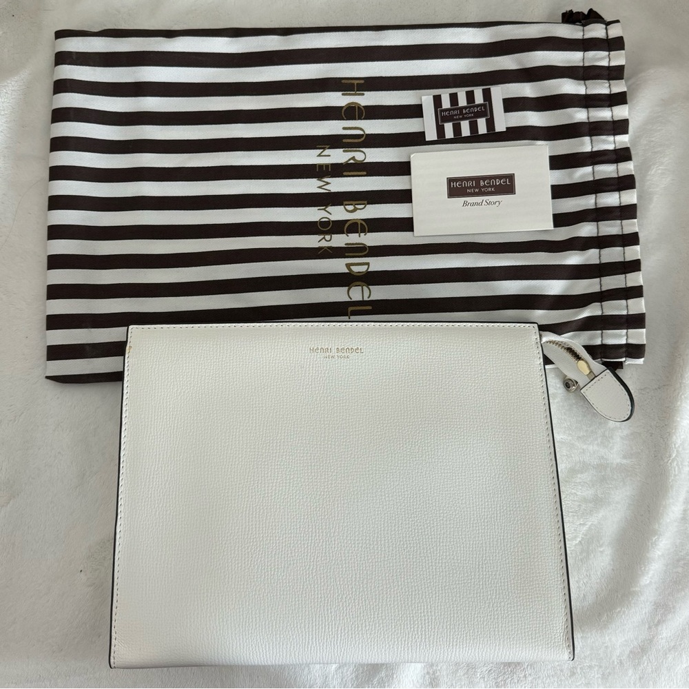 Henri Bendel Cluth or can be used as cosmetic bag.
